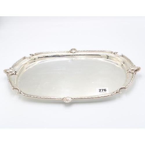  A silver tray, Northern Goldsmiths Co., Newcastle, assayed London, 1920, engraved scroll border, the... 