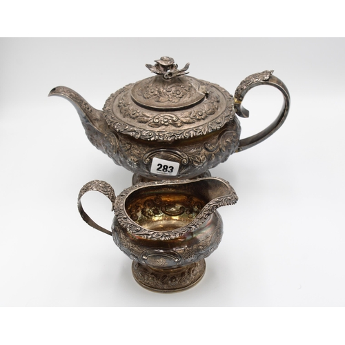  A large silver tea pot and cream jug, Jonathan Hayne, London, 1828 and 1830, cast and chased with fl... 