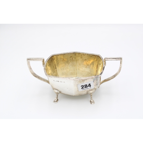  A silver sugar bowl, probably Kirwan & Co, Birmingham, 1944, squared handles and feet, width 18.... 