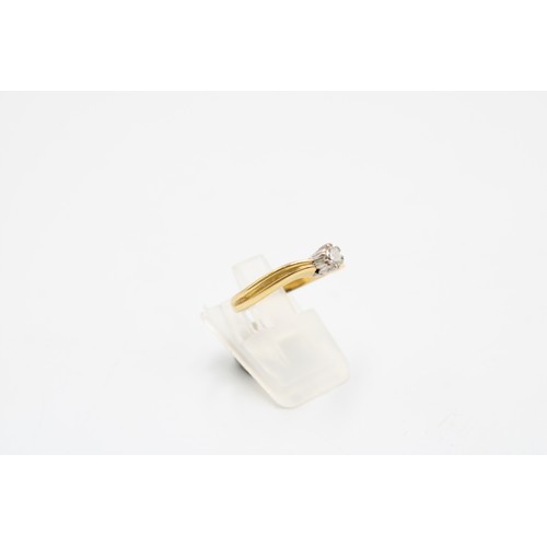  A diamond and gold solitaire ring, wavy shoulders, hallmarks partially rubbed, size L, gross weight ... 