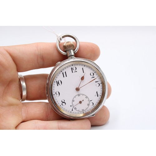  A silver open faced pocket watch, Swiss movement and .875 standard case, white enamel dial, subsidia... 