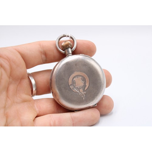  A silver open faced pocket watch, Swiss movement and .875 standard case, white enamel dial, subsidia... 