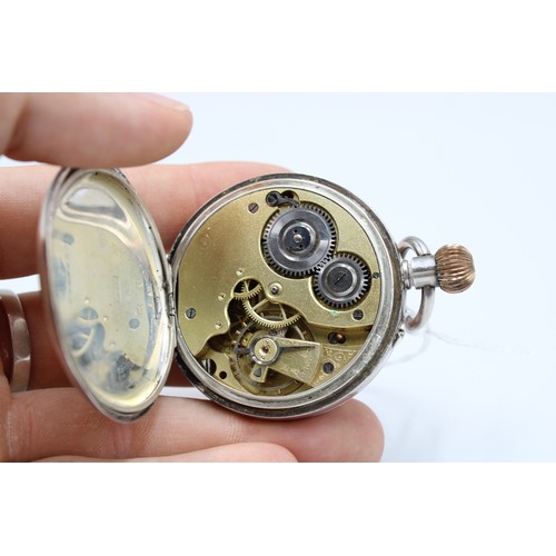  A silver open faced pocket watch, Swiss movement and .875 standard case, white enamel dial, subsidia... 