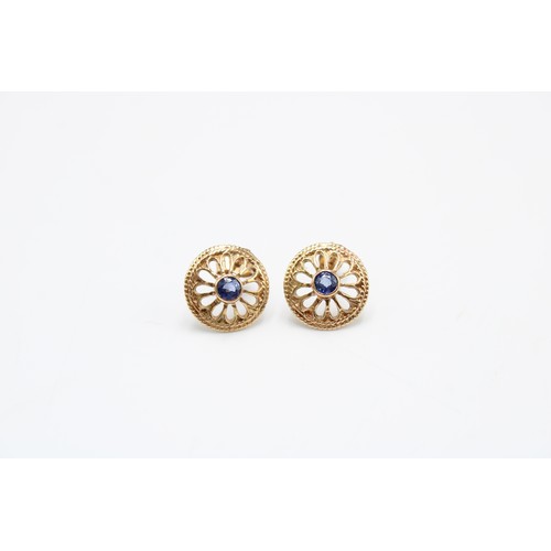  A pair of 9ct gold and sapphire earrings, the circular cut stones within an open rosette frame, appa... 