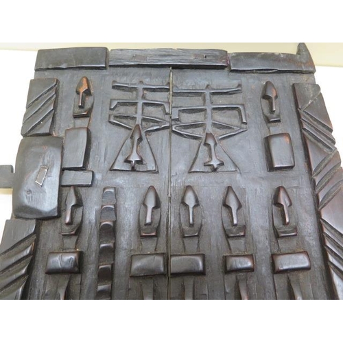 424 - A Dogan Mali carved granary door with figures and trees, 33cm x 28cm including latch