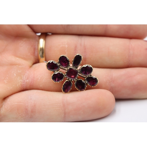 21 - A 15ct gold and almandine garnet brooch, probably early 19th century, unmarked but tested as 15 ct, ... 