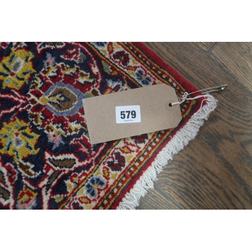 579 - A hand knotted woollen Kashan rug - 2.13m x 1.45m