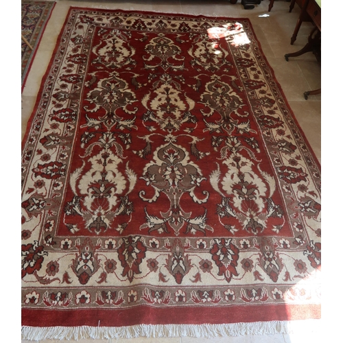 585 - A hand knotted woollen Heriz rug - 2.97m x 1.90m