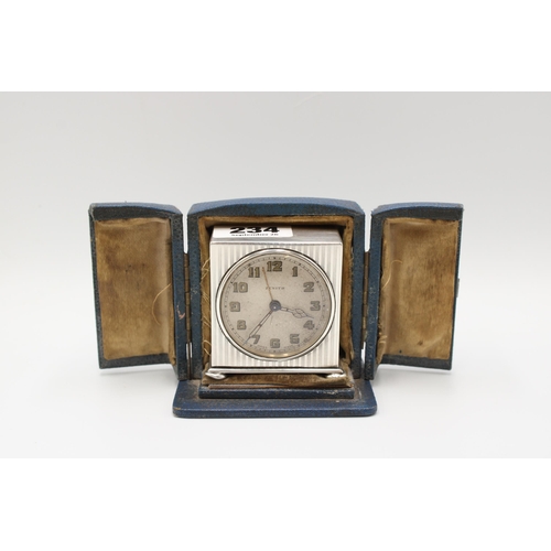 234 - A silver Zenith travelling alarm clock, the case George Neal & George Neal, London, 1922, height... 