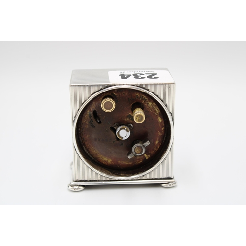 234 - A silver Zenith travelling alarm clock, the case George Neal & George Neal, London, 1922, height... 