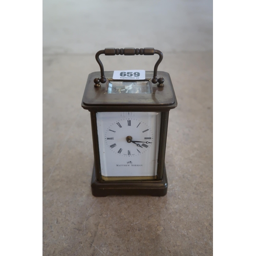 659 - A vintage brass and glass carriage clock, Matthew Norman, Del&eacute;mont, Switzerland, white enamel... 