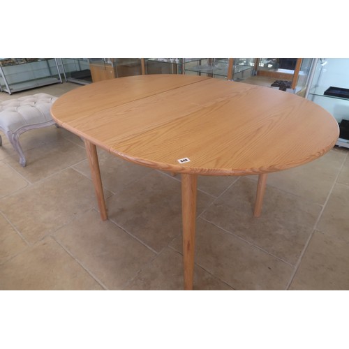 636 - A dining table from The Futon Company with a fold in leaf - retails at £400 - Length 130m