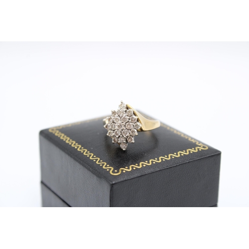  A brilliant cut diamond crossover cluster ring. Size P. Weight 6.24 grams.Condition: Minor signs of ... 