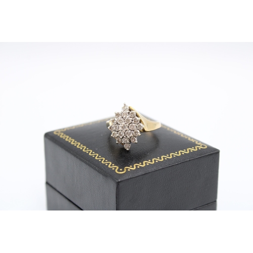  A brilliant cut diamond crossover cluster ring. Size P. Weight 6.24 grams.Condition: Minor signs of ... 