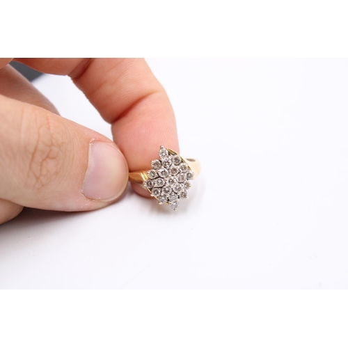  A brilliant cut diamond crossover cluster ring. Size P. Weight 6.24 grams.Condition: Minor signs of ... 