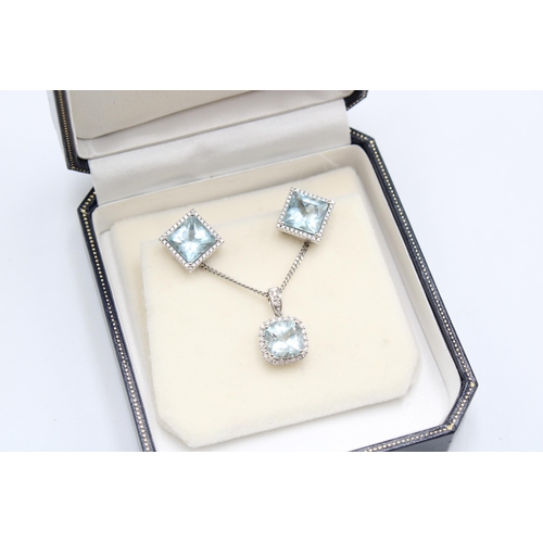  An 18ct gold aquamarine and diamond cluster pendant and earring set. Length of pendant 15mm, length ... 