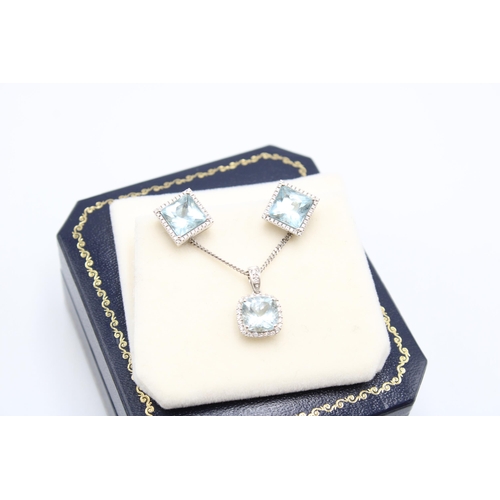  An 18ct gold aquamarine and diamond cluster pendant and earring set. Length of pendant 15mm, length ... 