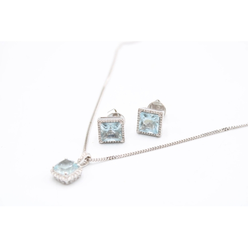  An 18ct gold aquamarine and diamond cluster pendant and earring set. Length of pendant 15mm, length ... 
