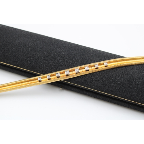  A textured articulated bracelet with eight graduating brilliant cut diamond collets to the grooved c... 