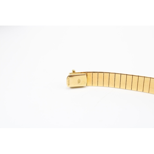  A textured articulated bracelet with eight graduating brilliant cut diamond collets to the grooved c... 