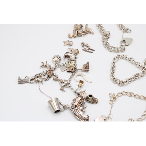  An Assortment of Silver Charm Bracelets to include One Damaged 9ct Figaro Chain&nbsp;Gross Silver We... 