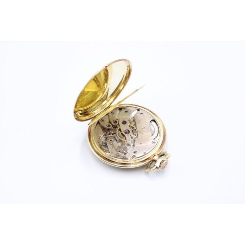  A 14ct Open Faced Longines Pocket Watch, Featuring Silvered dial with applied Yellow Hands & Num... 