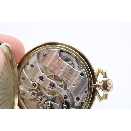  A 14ct Open Faced Longines Pocket Watch, Featuring Silvered dial with applied Yellow Hands & Num... 