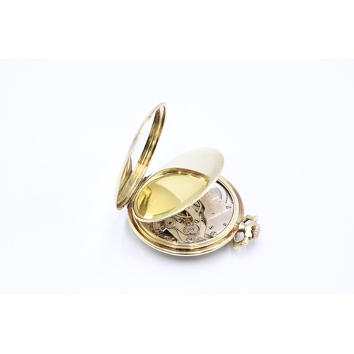  A 14ct Open Faced Longines Pocket Watch, Featuring Silvered dial with applied Yellow Hands & Num... 