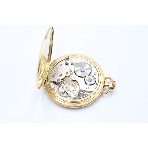 An 18ct Open Faced Pocket watch, Featuring a silvered dial with stylised arabic numerals, subsidiary... 