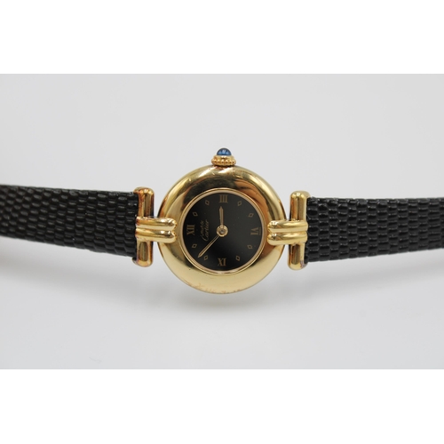 A Ladies Cartier 'Colisee', Ref 590002, 24mm, Quartz. Featuring a gold plated sterling silver case, black enamel dial and roman numerals. Condition: Case in good order, keeping time well.