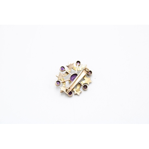  An early 20th century amethyst and seed pearl openwork cluster brooch. Stamped 9ct. Width 28mm. Stam... 