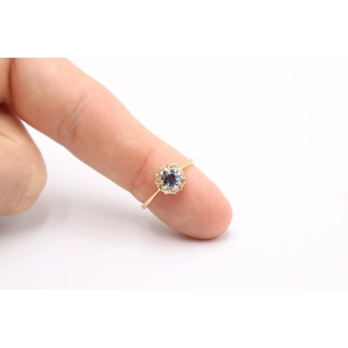  A circular sapphire and old cut diamond cluster ring. Size L 1/2. Stamped 18K. Weight 2.43 gramsGood... 