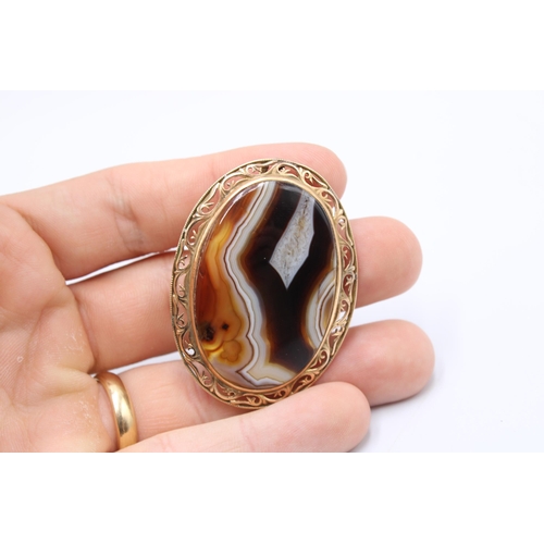  A 14ct Oval Striped Agate Brooch / Pendant 6cm x 4cm.&nbsp;Weight: 14.85g Condition: Stone appears f... 