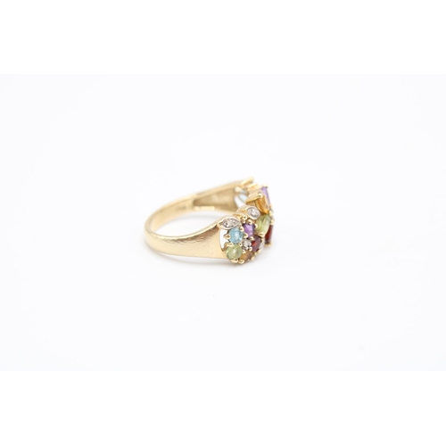  A 9ct gold and multicoloured gem-set ring, the stones set as three flowerheads within diamonds, stru... 