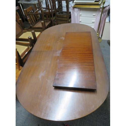 447 - Extending dining table by Strongbow Furniture