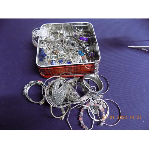 302 - Tin of Silver Tone Bangles and Bracelets