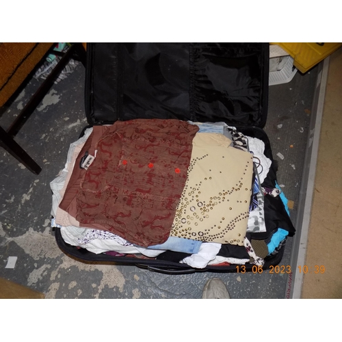 35 - Large Suitcase of Ladies Clothing