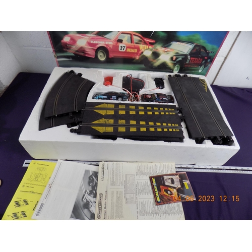 90 - Ford RS Cosworth Scalextric Set - 1 car has been swapped for a Jaguar