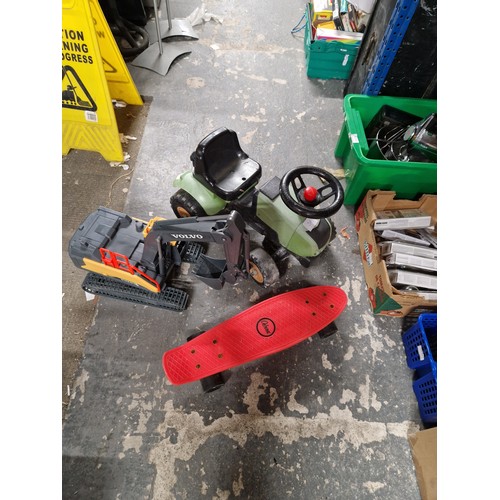 31 - Selection of Outdoor Toys. Inc Digger, Ride-On Tractor and Skate Board