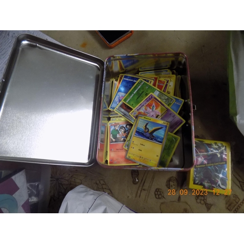 551 - Tin of Genuine Pokemon Cards incs Holos