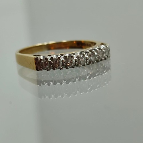 134 - Seven Stone Diamond Half Hoop Eternity Ring: Brilliant-cut diamonds point-set in plain 18ct gold sha... 