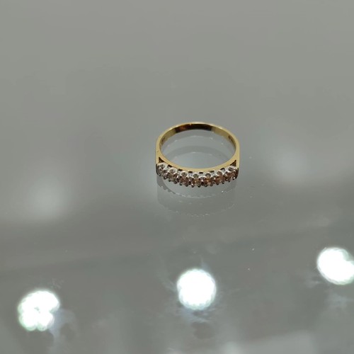 134 - Seven Stone Diamond Half Hoop Eternity Ring: Brilliant-cut diamonds point-set in plain 18ct gold sha... 