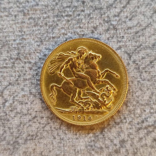 140 - 1914 George V Gold Sovereign Coin: 22 carat gold British coin featuring St. George and Dragon revers... 