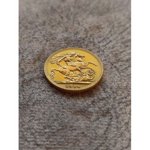 140 - 1914 George V Gold Sovereign Coin: 22 carat gold British coin featuring St. George and Dragon revers... 