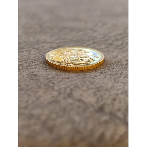 140 - 1914 George V Gold Sovereign Coin: 22 carat gold British coin featuring St. George and Dragon revers... 