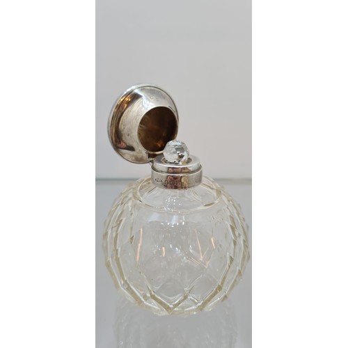 149 - 1923 Hasset and Harper Ltd crystal and Silver Bottle