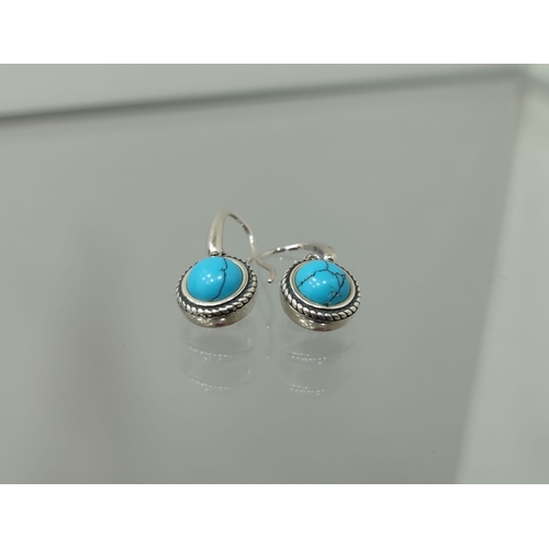 133 - Designer silver earrings with turquoise  earrings in box. The earrings are stamped 925 and have the ... 