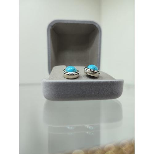 133 - Designer silver earrings with turquoise  earrings in box. The earrings are stamped 925 and have the ... 