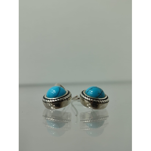 133 - Designer silver earrings with turquoise  earrings in box. The earrings are stamped 925 and have the ... 