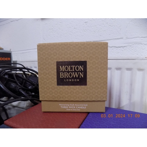 143 - Large Molton Brown Candle Mesmerising Oudh Accord & Gold